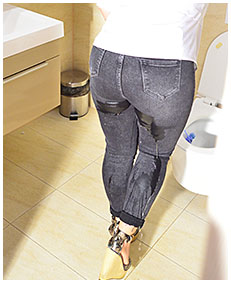 lady wearing tight black jeans wets herself while wiping toilet 1