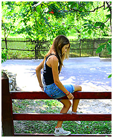sexy teen pisses her jeans shorts climbing a fence wetting herself pissing her pants 01