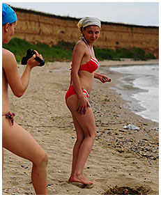 bathing suit accident wetting on the beach sand 00