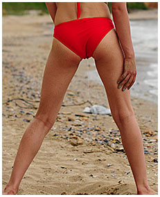 bathing suit accident wetting on the beach sand 00