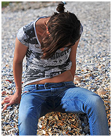 beach desperation natalie wets her blue jeans on the beach pissing herself 03