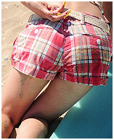 alice is pissing her shorts on the beach 01