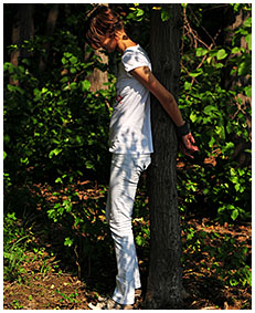 peeing in white jeans while she is tied to a tree 04
